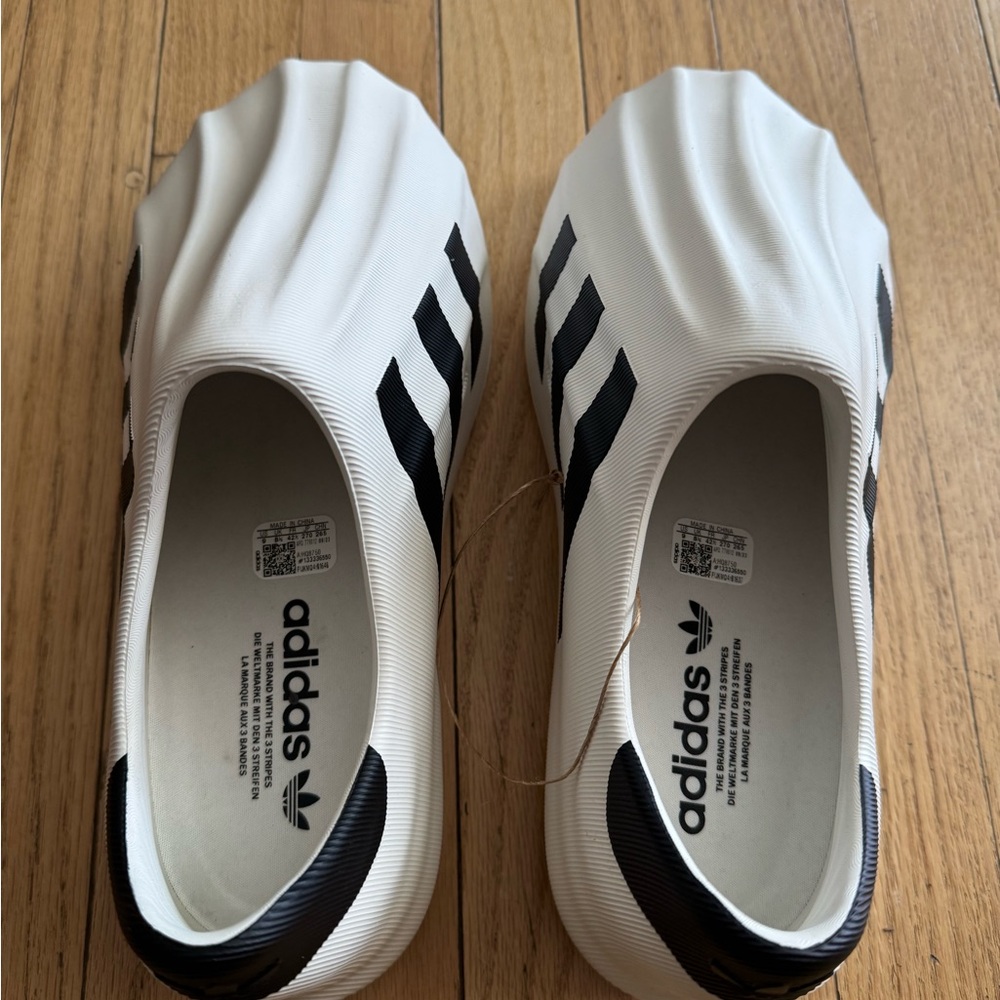 Yeezy Adidas White and Black Sneakers. Mint condition. Never worn. US size 9.